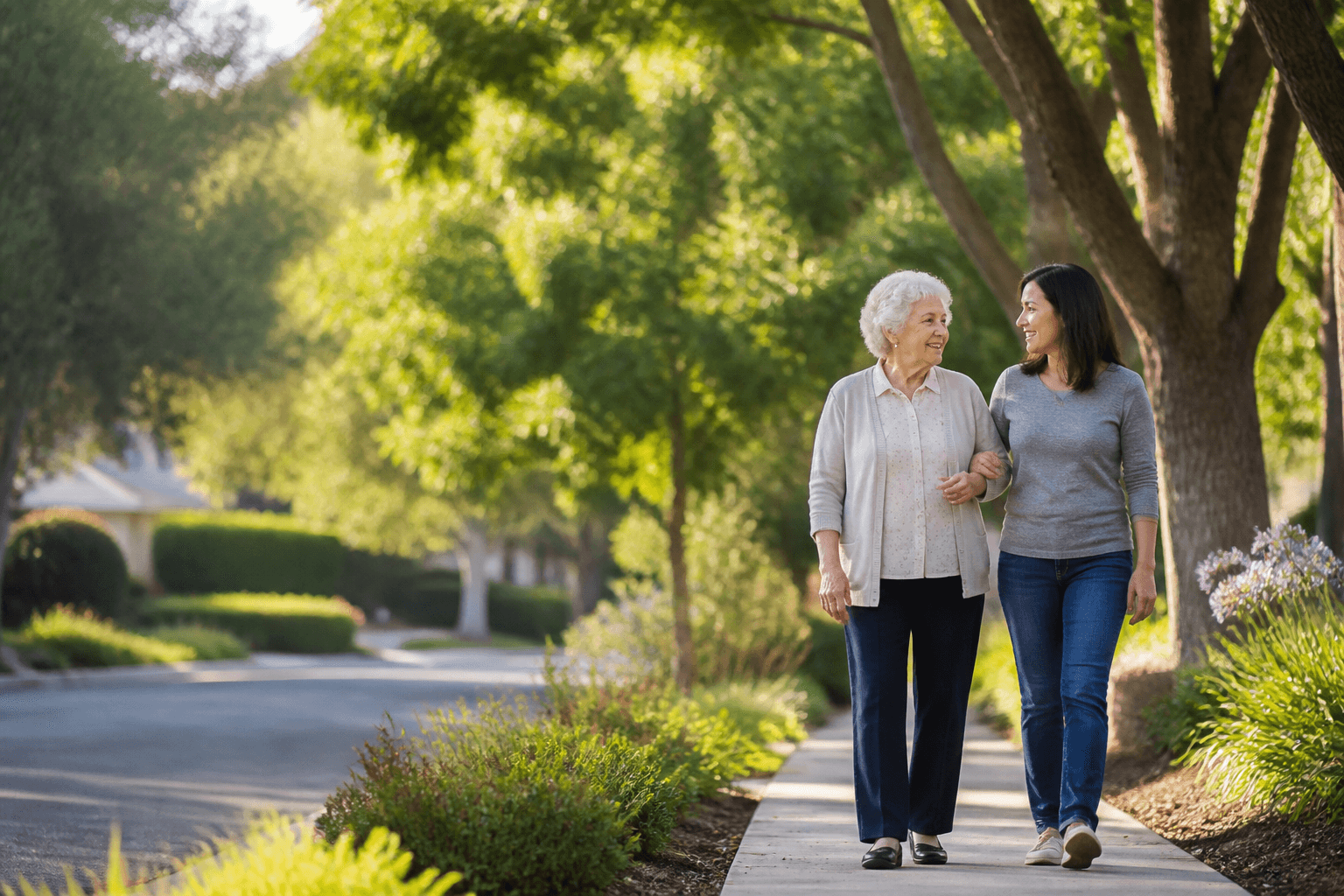 Companion and older adult walking together outdoors
